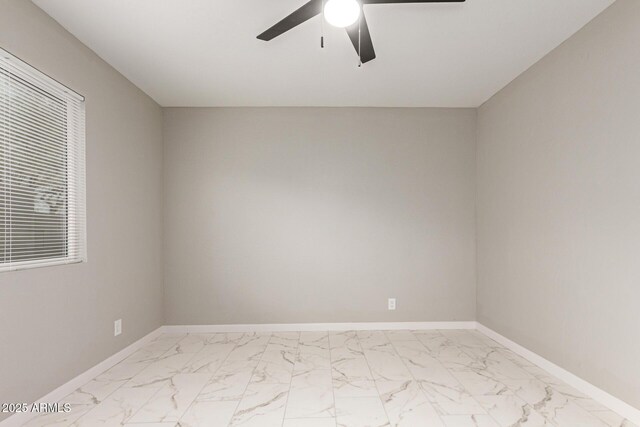 9105 N 13th St, Phoenix, AZ 85020 - spare room with baseboards, marble finish floor, and ceiling fan