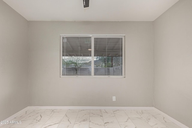 9105 N 13th St, Phoenix, AZ 85020 - spare room with marble finish floor, baseboards, and ceiling fan