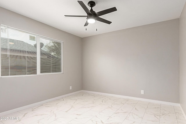 9105 N 13th St, Phoenix, AZ 85020 - empty room featuring marble finish floor, baseboards, and ceiling fan