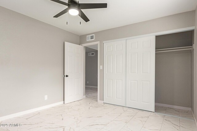 9105 N 13th St, Phoenix, AZ 85020 - unfurnished bedroom featuring visible vents, marble finish floor, a closet, and baseboards