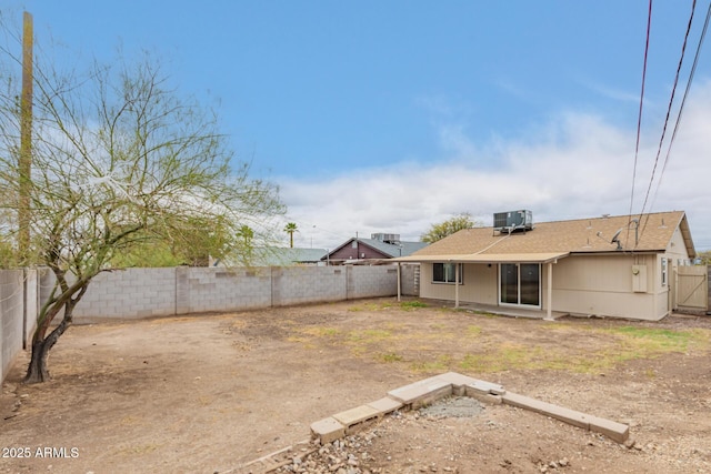9105 N 13th St, Phoenix, AZ 85020 - rear view of property featuring cooling unit, a fenced backyard, and roof with shingles