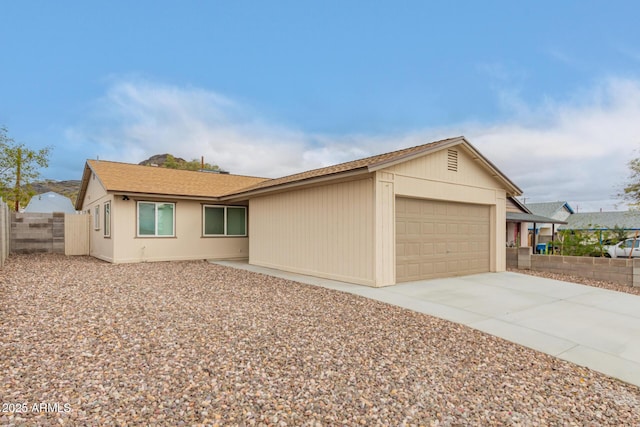 9105 N 13th St, Phoenix, AZ 85020 - view of front of house with a garage, driveway, and fence