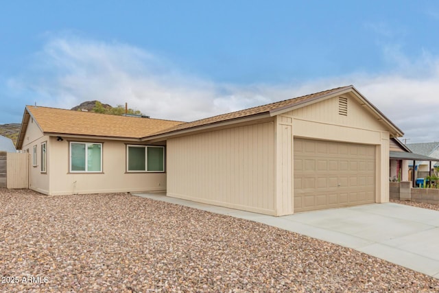 9105 N 13th St, Phoenix, AZ 85020 - view of front of house featuring driveway and an attached garage