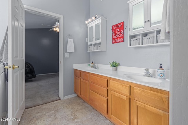 bathroom featuring ceiling fan and vanity