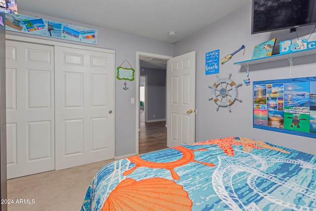 carpeted bedroom featuring a closet