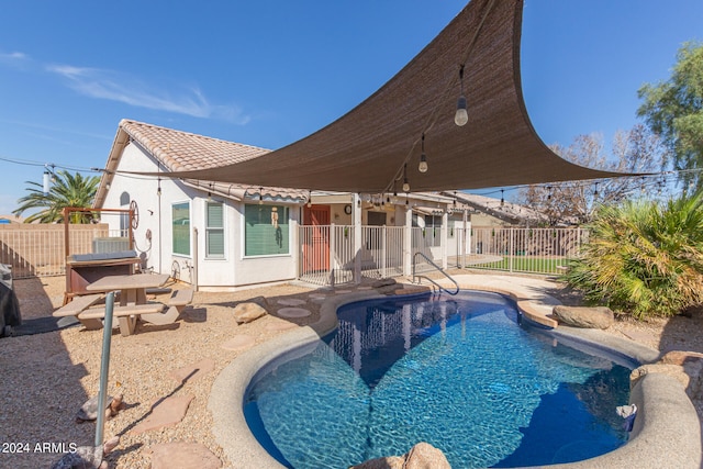 view of swimming pool featuring a patio area