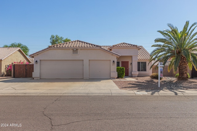 mediterranean / spanish home featuring a garage