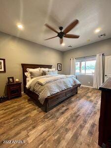 bedroom featuring wood-type flooring and ceiling fan