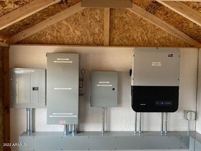 utility room featuring water heater