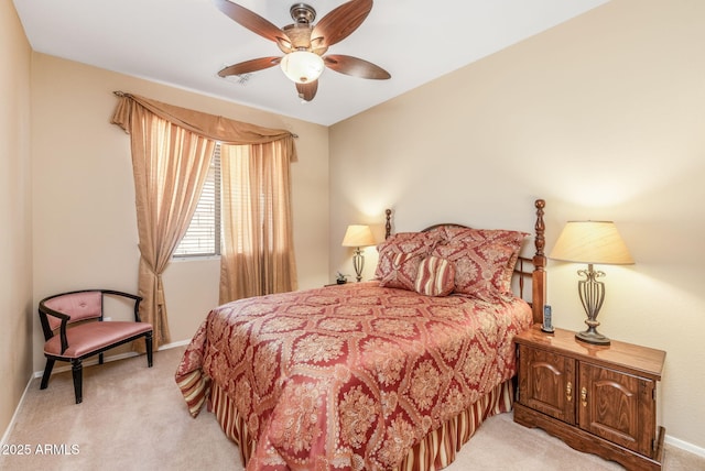 bedroom with light colored carpet and ceiling fan