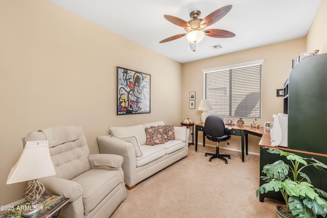 carpeted home office with ceiling fan