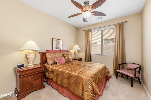 bedroom featuring light colored carpet and ceiling fan