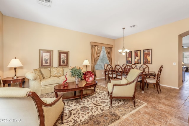 living room with a notable chandelier