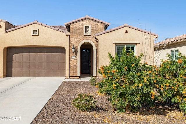 mediterranean / spanish house featuring a garage