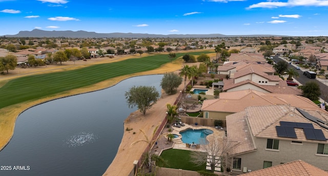 aerial view with a residential view, view of golf course, and a water and mountain view