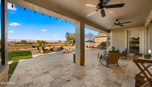 view of patio with a fenced in pool, outdoor dining space, a fenced backyard, and ceiling fan