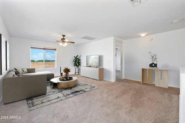 living room featuring ceiling fan, carpet, and visible vents