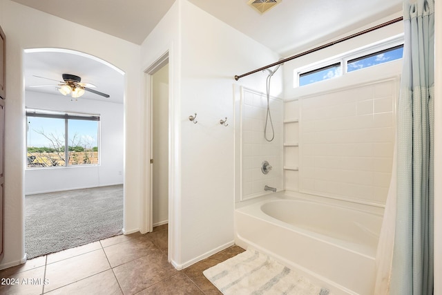 full bathroom with ceiling fan, tile patterned flooring, visible vents, baseboards, and shower / bath combo with shower curtain