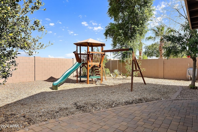 view of play area with a fenced backyard