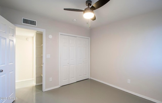 unfurnished bedroom featuring ceiling fan and concrete floors