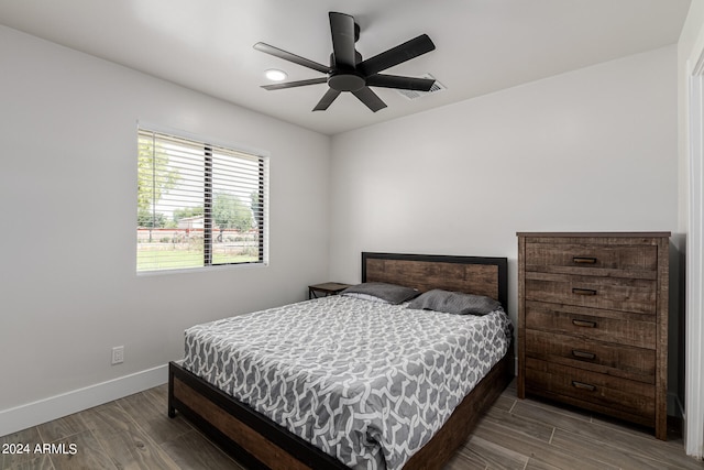 bedroom featuring ceiling fan and hardwood / wood-style floors