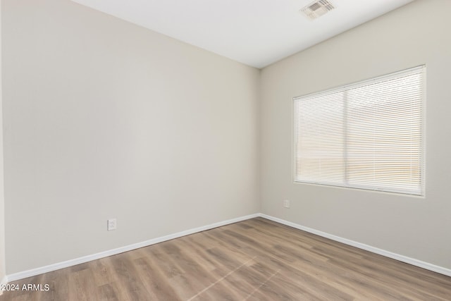 empty room featuring hardwood / wood-style flooring