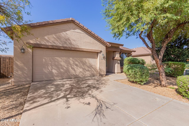 ranch-style home featuring a garage