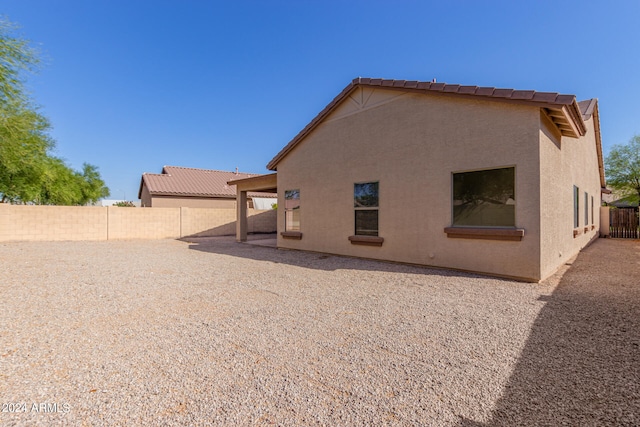 back of house with a patio area