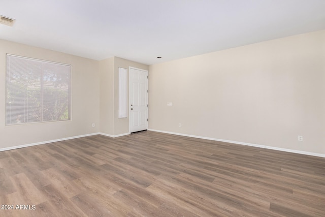 unfurnished room featuring wood-type flooring