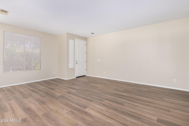 10722 W Jefferson St, Avondale, AZ 85323 - spare room featuring wood finished floors and baseboards