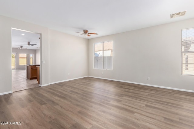10722 W Jefferson St, Avondale, AZ 85323 - unfurnished room with ceiling fan, wood finished floors, baseboards, and recessed lighting