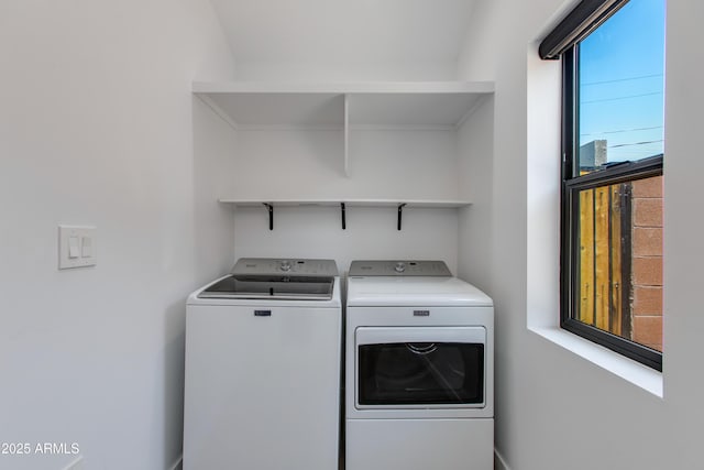 laundry room featuring washing machine and clothes dryer