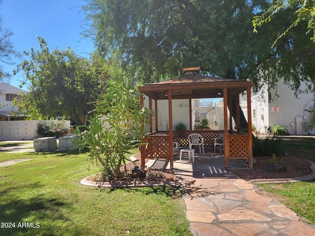 view of front of home featuring a patio, a gazebo, and a front yard