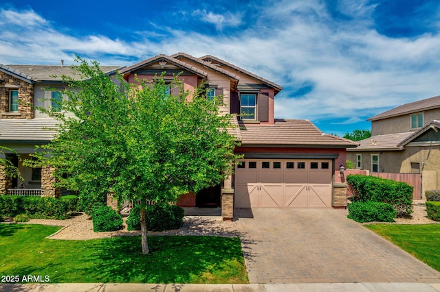 3072 E Appaloosa Rd, Gilbert, AZ 85296 - craftsman inspired home with a front lawn, a tiled roof, stone siding, an attached garage, and decorative driveway