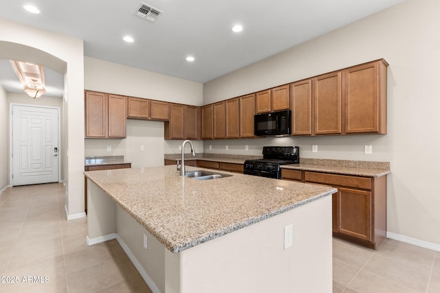 3072 E Appaloosa Rd, Gilbert, AZ 85296 - kitchen with a sink, light tile patterned flooring, visible vents, brown cabinets, and black appliances