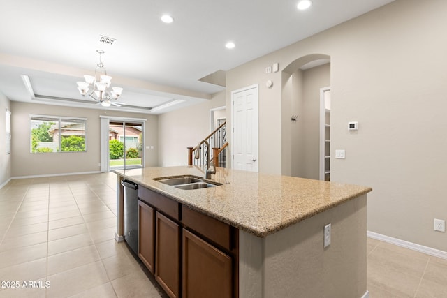 3072 E Appaloosa Rd, Gilbert, AZ 85296 - kitchen with arched walkways, a sink, a chandelier, light tile patterned floors, and hanging light fixtures