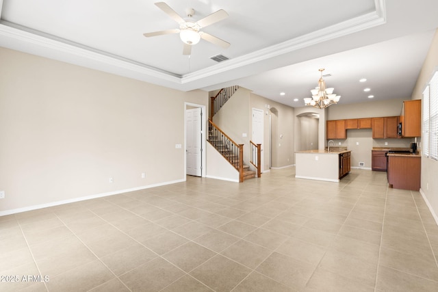 3072 E Appaloosa Rd, Gilbert, AZ 85296 - unfurnished living room featuring arched walkways, stairway, a tray ceiling, and ceiling fan with notable chandelier