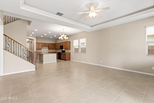 3072 E Appaloosa Rd, Gilbert, AZ 85296 - unfurnished living room with crown molding, visible vents, stairway, and a tray ceiling