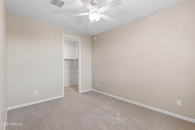 3072 E Appaloosa Rd, Gilbert, AZ 85296 - unfurnished bedroom featuring visible vents, a walk in closet, a closet, baseboards, and carpet flooring