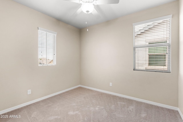 3072 E Appaloosa Rd, Gilbert, AZ 85296 - spare room featuring light colored carpet, baseboards, and a ceiling fan