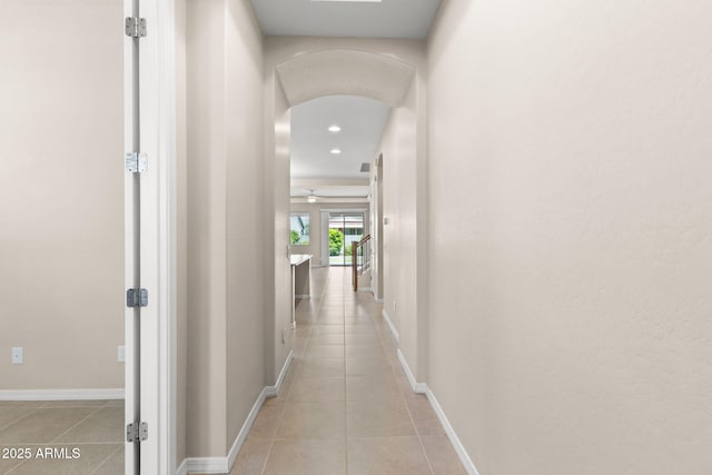 3072 E Appaloosa Rd, Gilbert, AZ 85296 - hall featuring baseboards, arched walkways, light tile patterned flooring, and recessed lighting