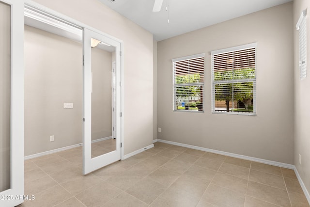 3072 E Appaloosa Rd, Gilbert, AZ 85296 - unfurnished bedroom featuring a ceiling fan, baseboards, and light tile patterned floors