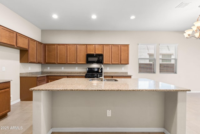 3072 E Appaloosa Rd, Gilbert, AZ 85296 - kitchen featuring light stone counters, visible vents, a sink, black appliances, and brown cabinetry