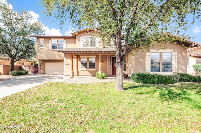 18544 E Caledonia Dr, Queen Creek, AZ 85142 - mediterranean / spanish-style home with a front yard, stucco siding, concrete driveway, a garage, and a tile roof