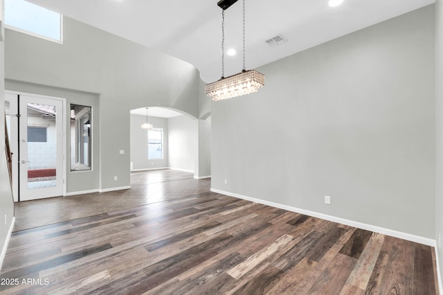 18544 E Caledonia Dr, Queen Creek, AZ 85142 - interior space featuring wood finished floors, arched walkways, visible vents, and baseboards