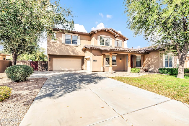 18544 E Caledonia Dr, Queen Creek, AZ 85142 - mediterranean / spanish-style house featuring stucco siding, fence, and a tile roof