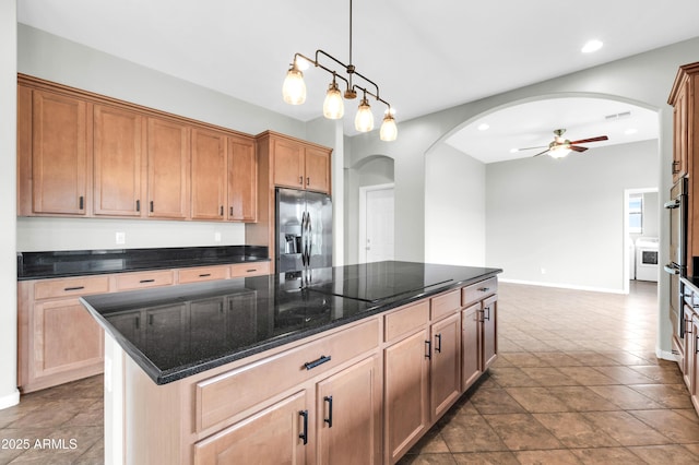 18544 E Caledonia Dr, Queen Creek, AZ 85142 - kitchen with black electric stovetop, stainless steel fridge with ice dispenser, arched walkways, and ceiling fan
