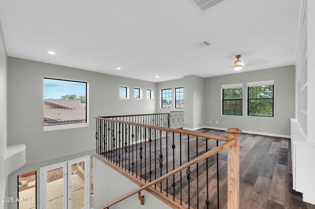 18544 E Caledonia Dr, Queen Creek, AZ 85142 - hallway with visible vents, dark wood-type flooring, baseboards, an upstairs landing, and recessed lighting