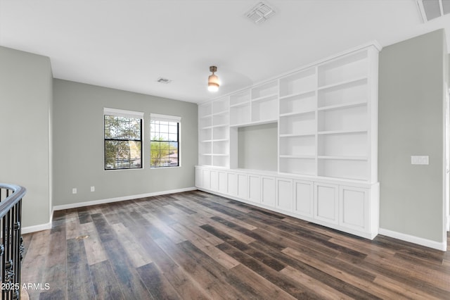 18544 E Caledonia Dr, Queen Creek, AZ 85142 - unfurnished living room featuring visible vents, dark wood-type flooring, and baseboards
