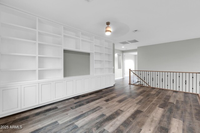 18544 E Caledonia Dr, Queen Creek, AZ 85142 - spare room featuring visible vents and dark wood-type flooring